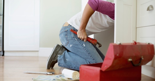 homeowner working on plumbing